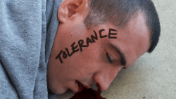 Trump supporter beaten unconscious by far left fascists who then wrote on the man's face exactly what they do NOT live by.